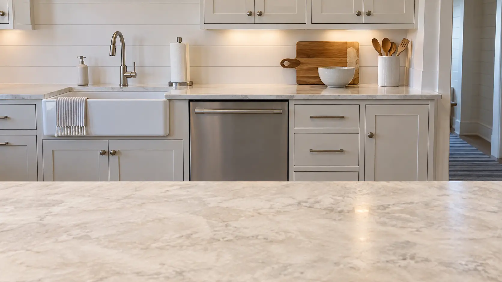 A dishwasher in a raised beach-house kitchen in painted board with a narrow galley run.